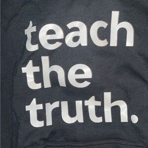 Teach the truth  hoodie. Normal wear and tear in high traffic areas